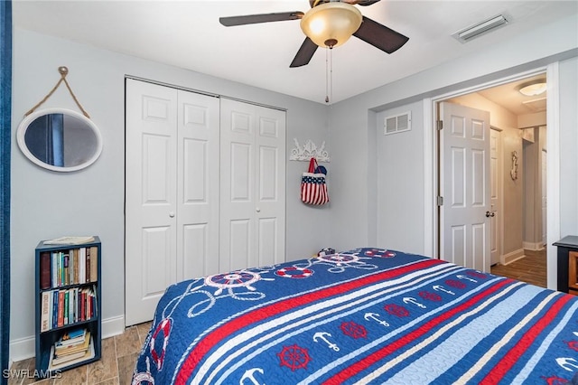 bedroom with ceiling fan, light hardwood / wood-style floors, and a closet