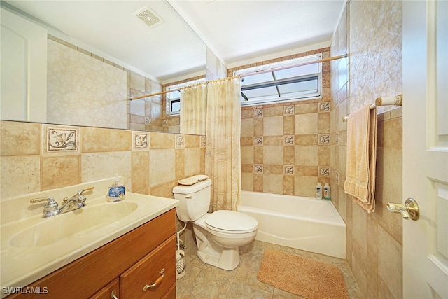 full bathroom featuring tile walls, vanity, toilet, shower / bathtub combination with curtain, and tile patterned floors