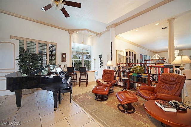 sitting room featuring light tile patterned floors, crown molding, decorative columns, and ceiling fan