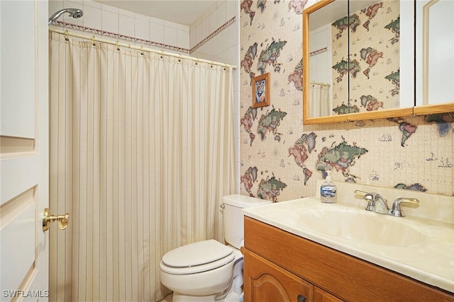 bathroom with vanity, toilet, and a shower with shower curtain