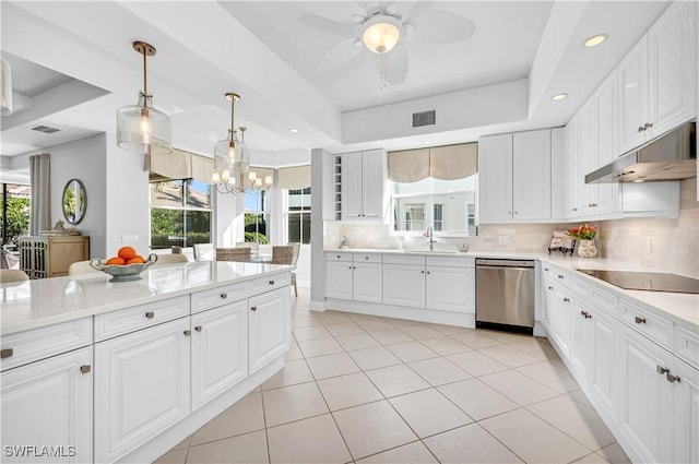 kitchen with black electric stovetop, a wealth of natural light, stainless steel dishwasher, and white cabinets