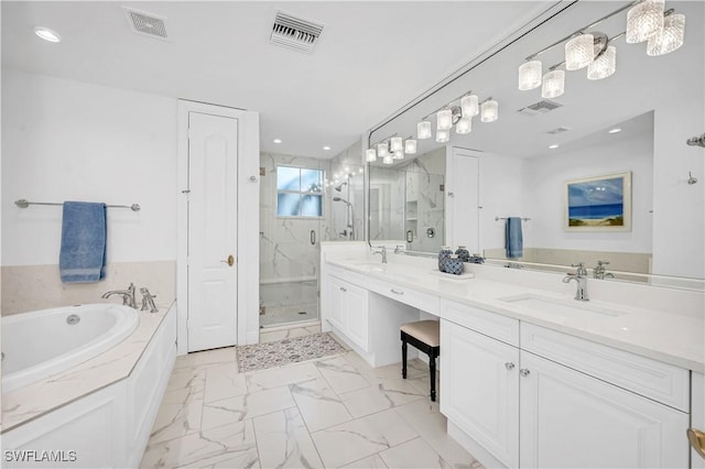 bathroom with vanity and separate shower and tub