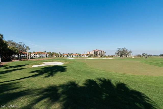 view of home's community featuring a lawn