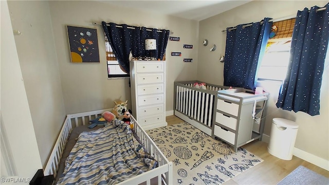 bedroom with light hardwood / wood-style flooring