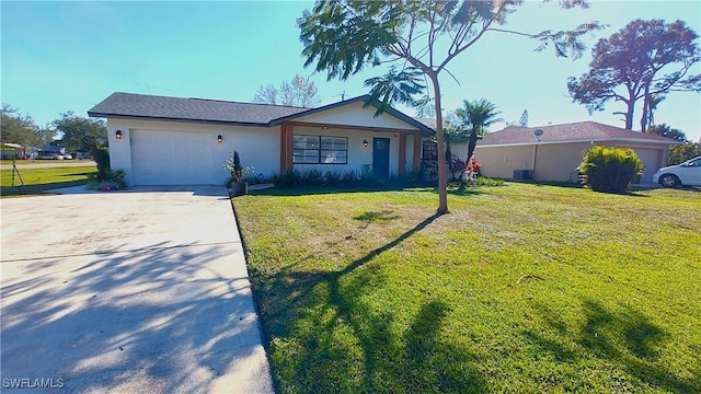 ranch-style house featuring a garage, central AC, and a front lawn