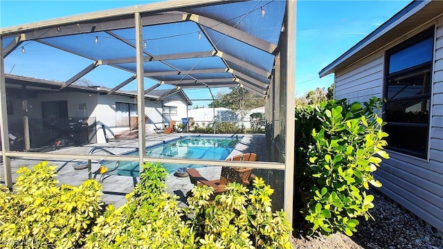 view of pool featuring a lanai, a fenced in pool, and a patio