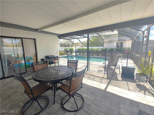 view of patio with glass enclosure, a grill, and a fenced in pool