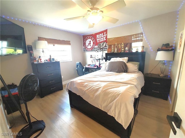 bedroom featuring a ceiling fan and light wood-style flooring