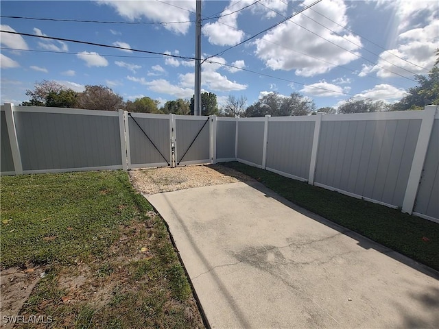 view of gate with fence