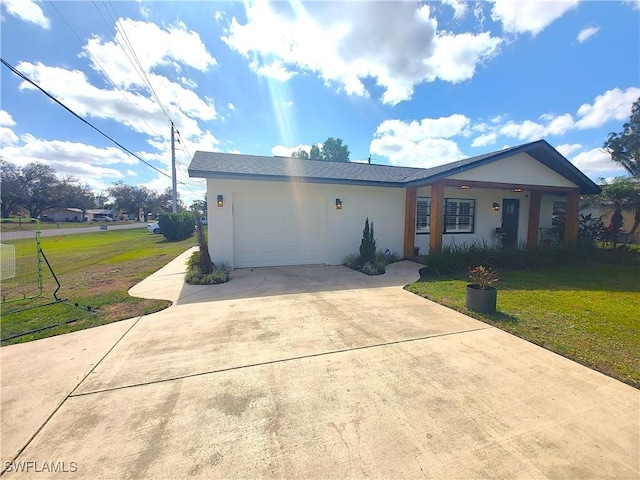 ranch-style house with an attached garage, driveway, a front lawn, and stucco siding