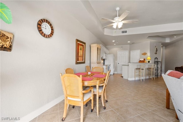 dining area with light tile patterned flooring and ceiling fan