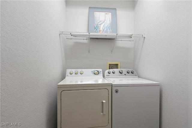 laundry area featuring washing machine and dryer