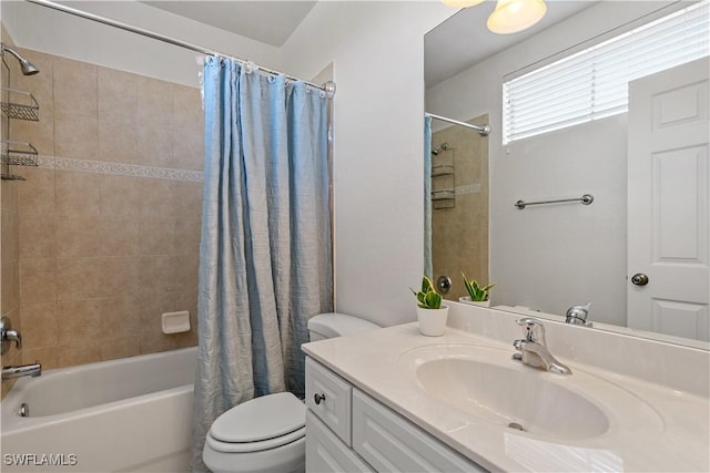 full bathroom featuring vanity, shower / tub combo with curtain, and toilet