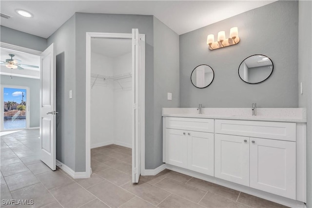 bathroom featuring vanity, tile patterned floors, and ceiling fan