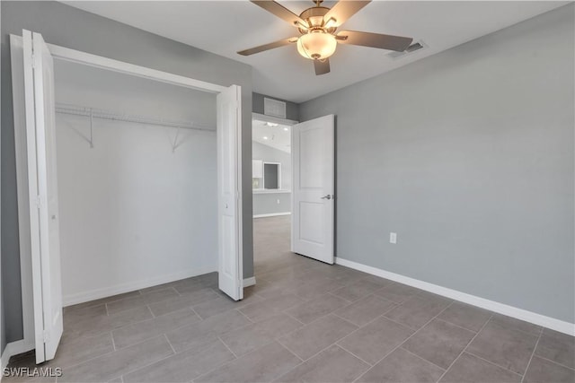 unfurnished bedroom featuring a closet and ceiling fan