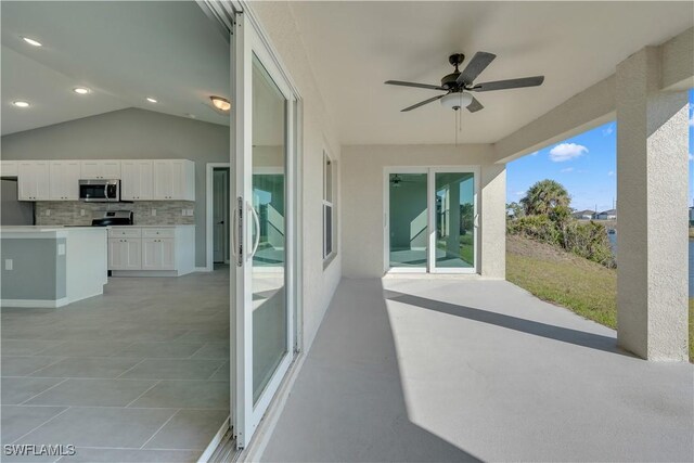 view of patio / terrace with exterior kitchen and ceiling fan