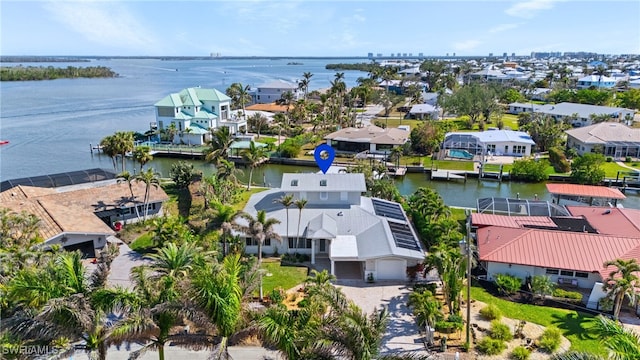 birds eye view of property featuring a water view