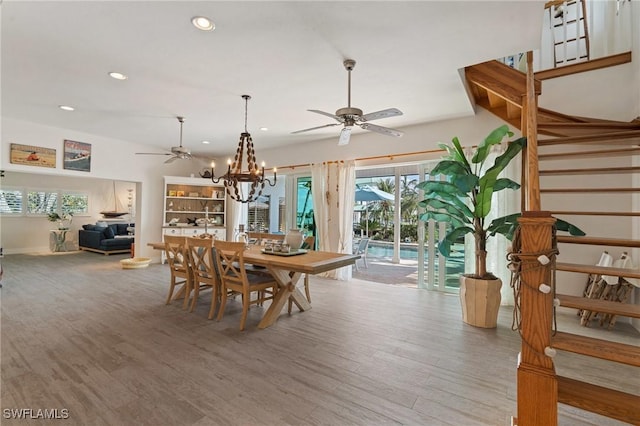 dining space featuring recessed lighting, wood finished floors, ceiling fan, and stairs