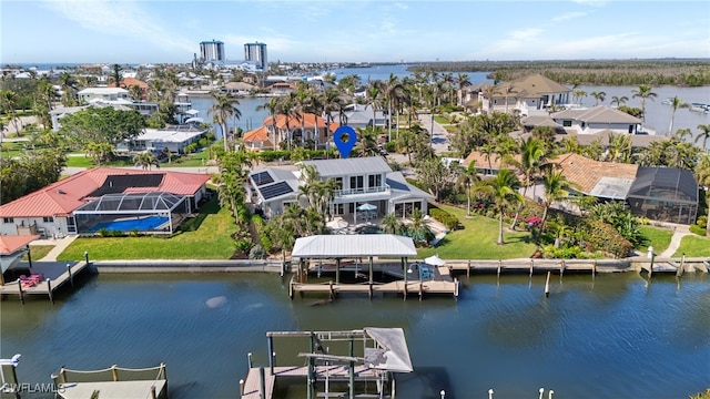 aerial view featuring a residential view and a water view