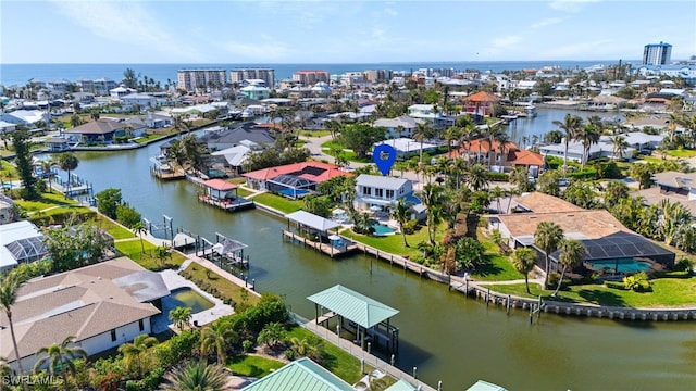 birds eye view of property featuring a residential view and a water view