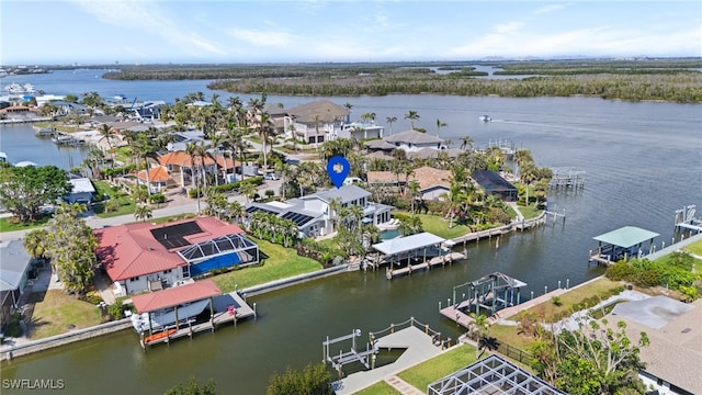 aerial view featuring a water view and a residential view