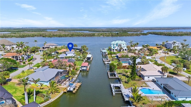 drone / aerial view featuring a residential view and a water view