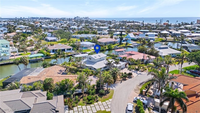 aerial view with a residential view and a water view