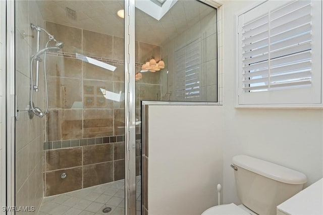 full bath with a stall shower and toilet