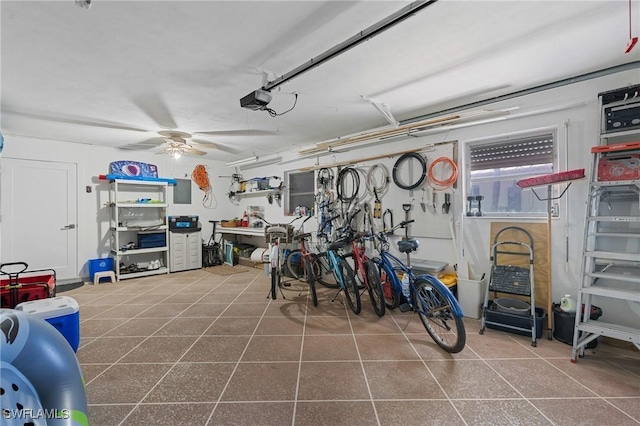 garage featuring ceiling fan and a garage door opener