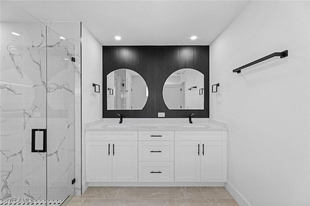 bathroom with walk in shower and vanity