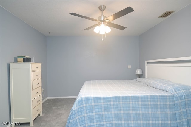 bedroom featuring light colored carpet and ceiling fan