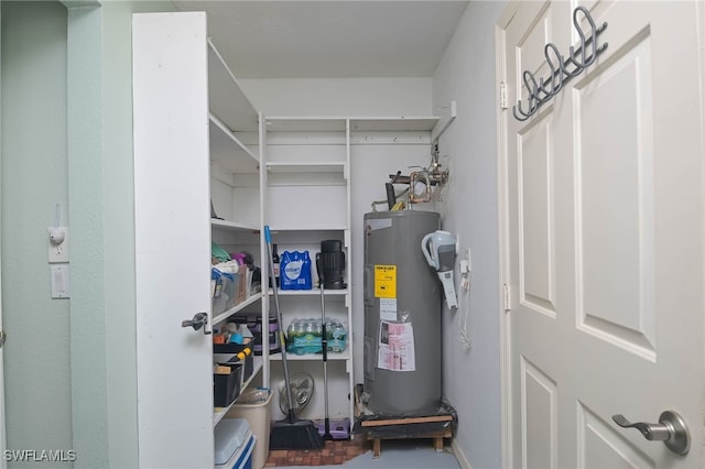 utility room featuring electric water heater