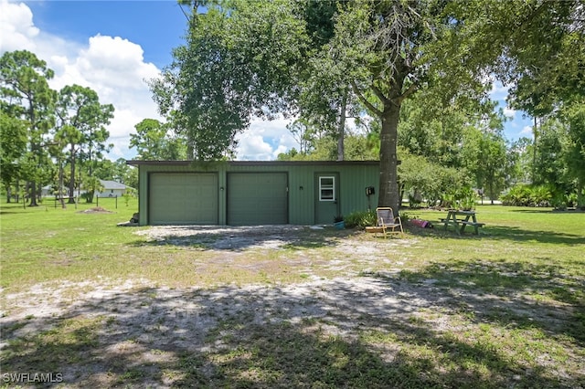 garage with a yard