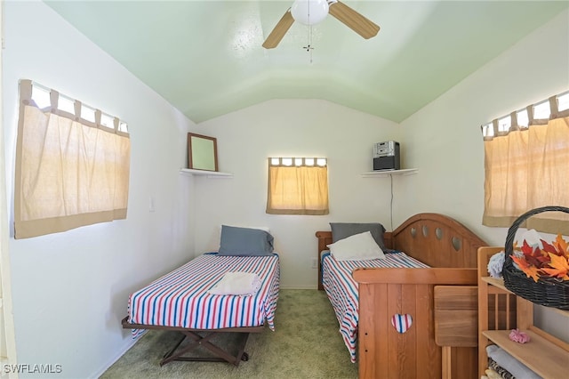 carpeted bedroom with vaulted ceiling and ceiling fan