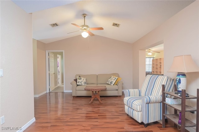 living room with lofted ceiling, wood-type flooring, and ceiling fan