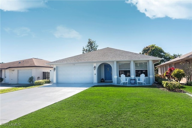 ranch-style house featuring a garage and a front yard