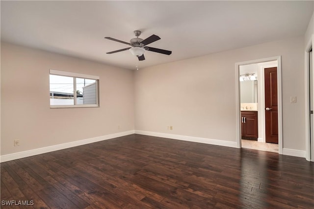 empty room with dark hardwood / wood-style floors and ceiling fan