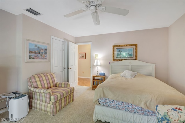 carpeted bedroom with ceiling fan