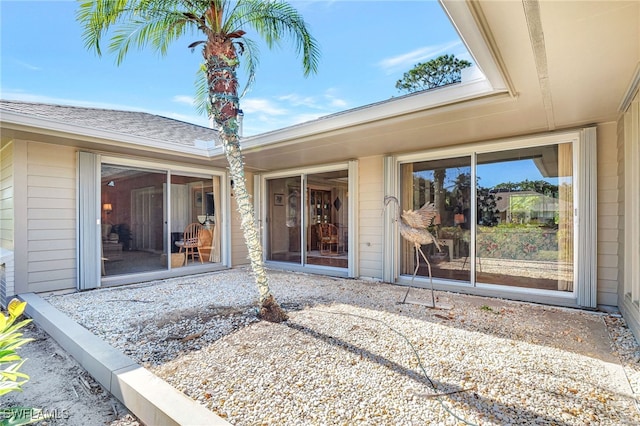 entrance to property featuring a patio area