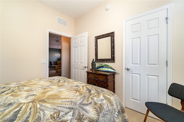 bedroom with light colored carpet