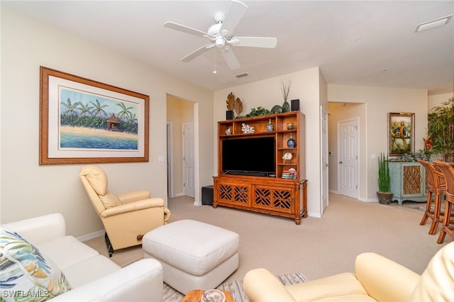 living room with ceiling fan and light colored carpet