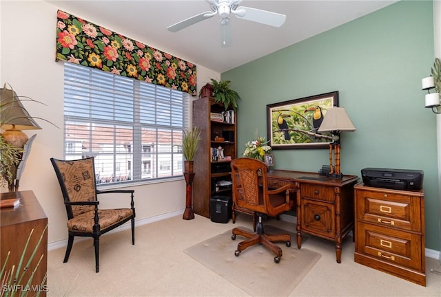 carpeted office with ceiling fan