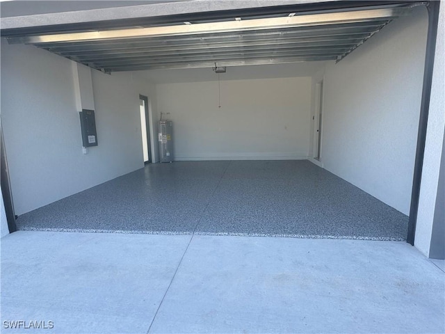 garage featuring electric panel and water heater