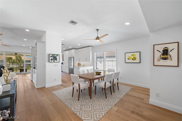 dining room with ceiling fan, light hardwood / wood-style flooring, and a healthy amount of sunlight