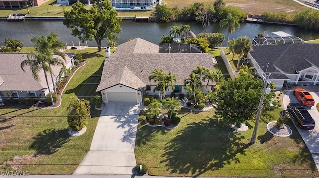 birds eye view of property with a water view