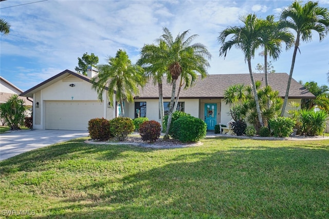 ranch-style house featuring a garage and a front lawn