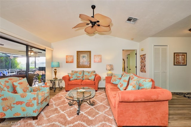 living room featuring ceiling fan, lofted ceiling, and hardwood / wood-style floors