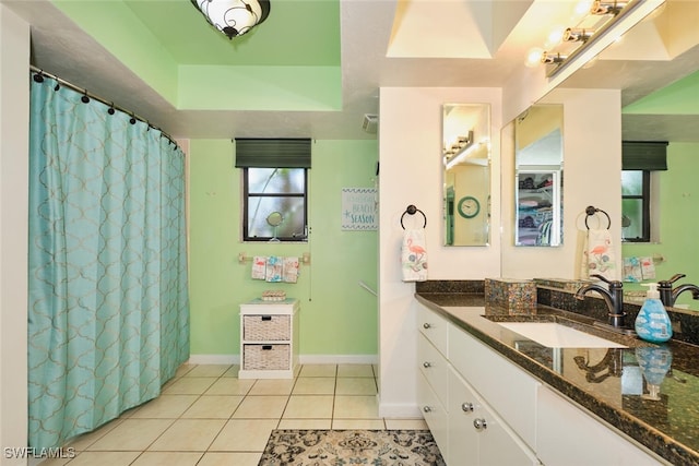 bathroom featuring tile patterned flooring and vanity