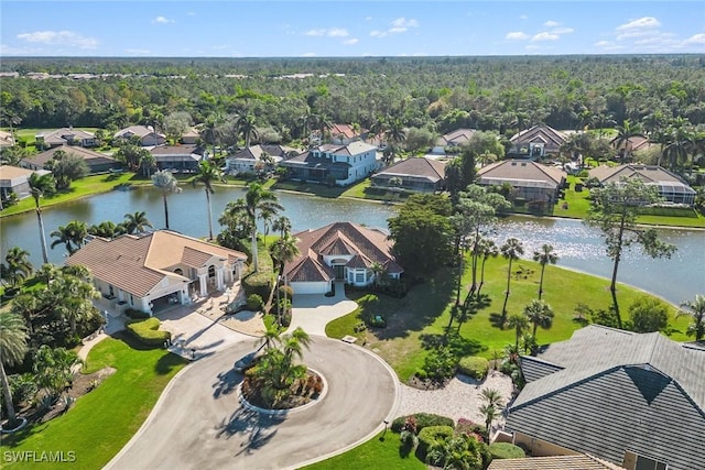 drone / aerial view featuring a residential view and a water view