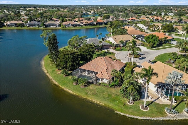 bird's eye view featuring a water view and a residential view